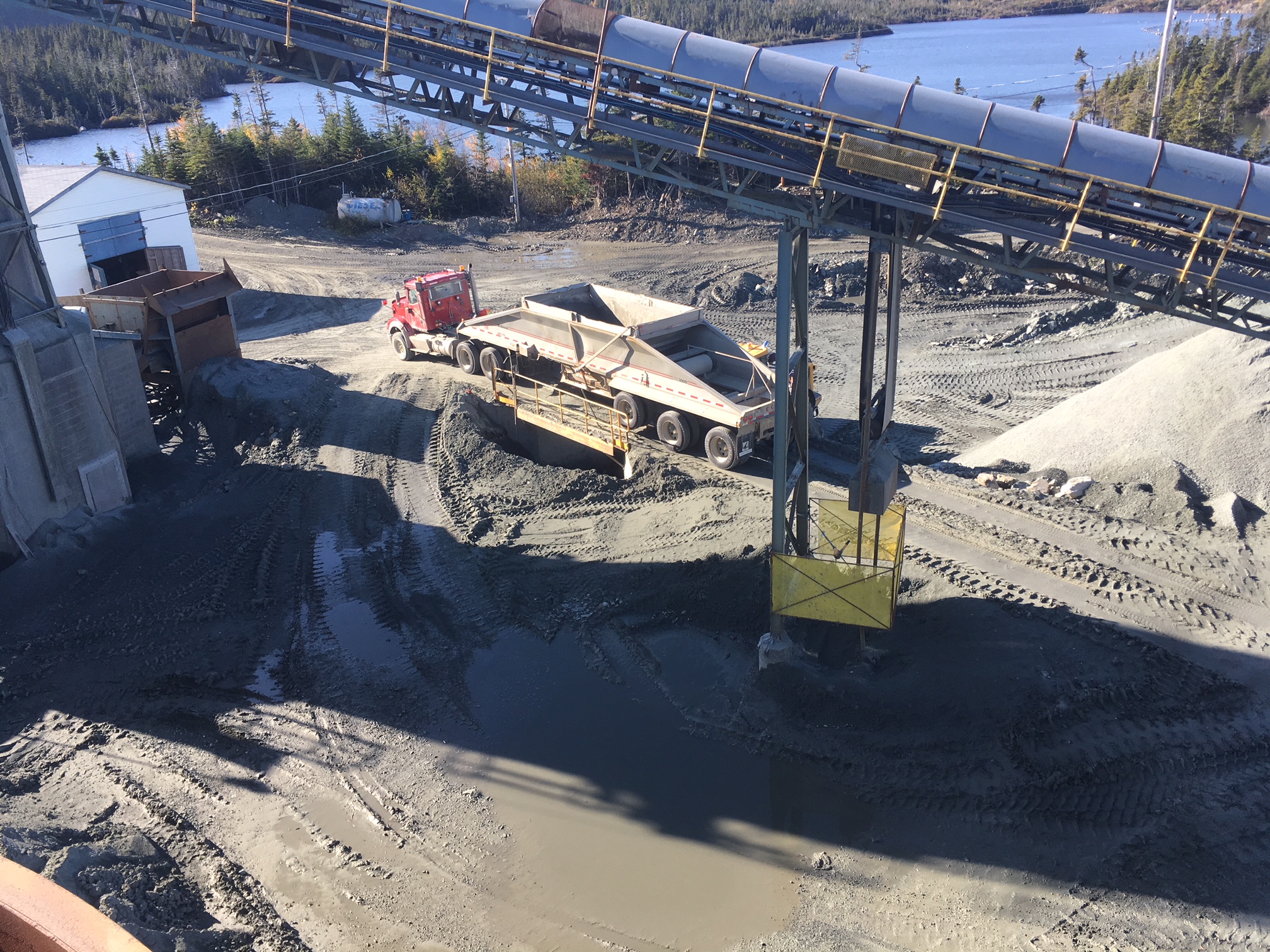 Copper ore being dumped at Nugget Pond